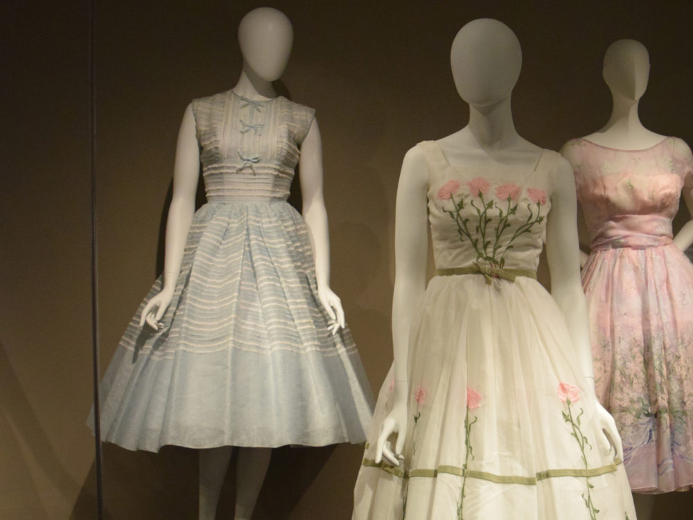 Dior Exhibit of 3 flowing dresses on mannequins in the Richard Blackwell Gallery