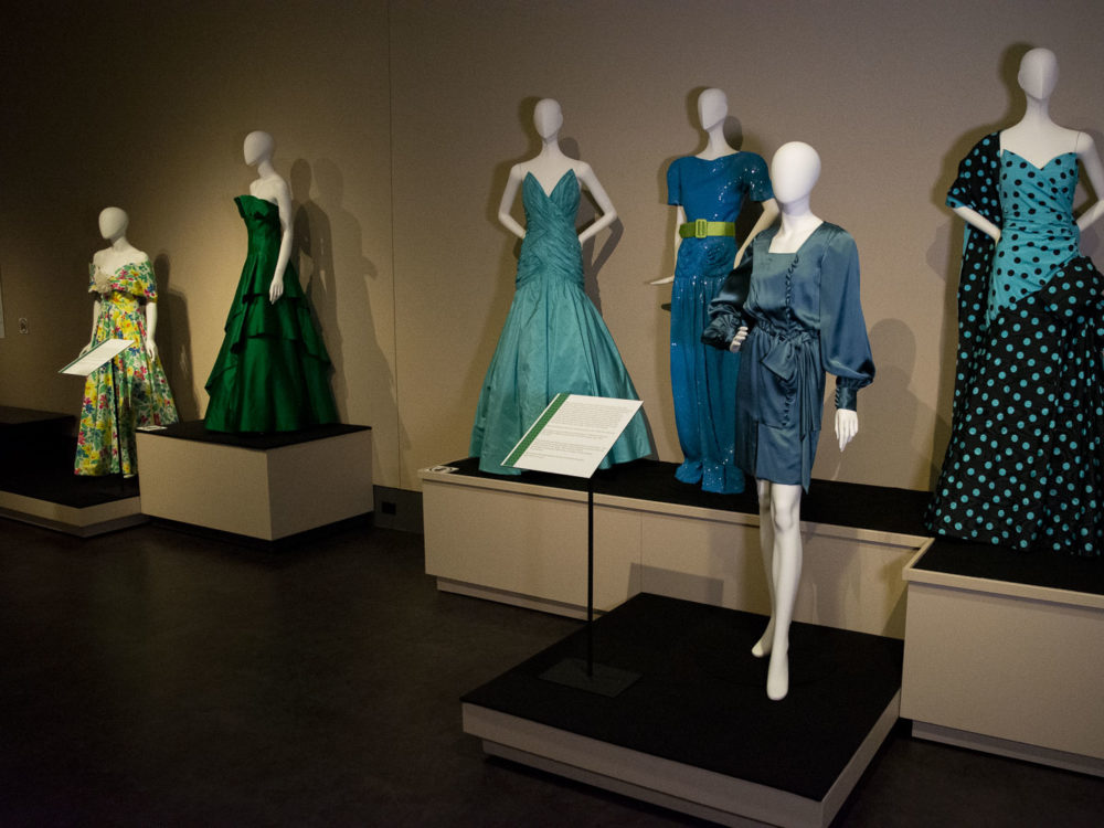 6 dress forms adorned in beautiful blue garments on display in the Avenir Museum Gallery.