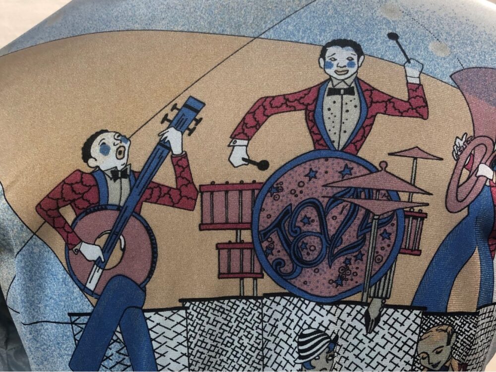 A detail of a back of a shirt with a graphic of jazz musicians