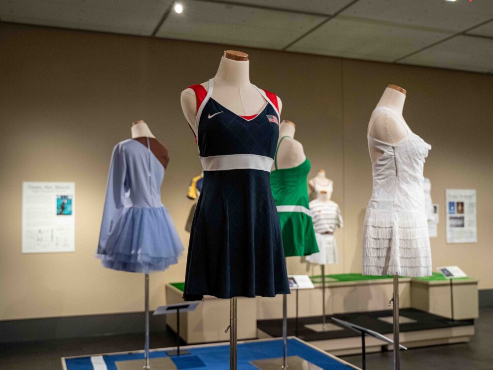 A wide view of the Courting Style exhibit featuring 4 dress forms with garments.