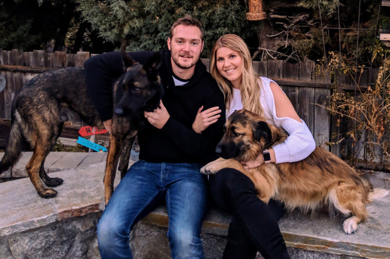 Brett pictured with his girlfriend and their two dogs