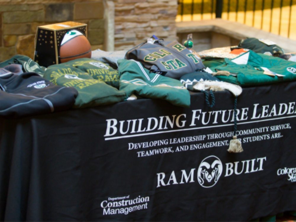 `Building Future Leaders` with RamBuilt logo on side of tablecloth for CM clothing apparel booth
