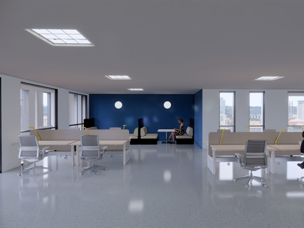 An employee communal space featuring a blue accent wall.