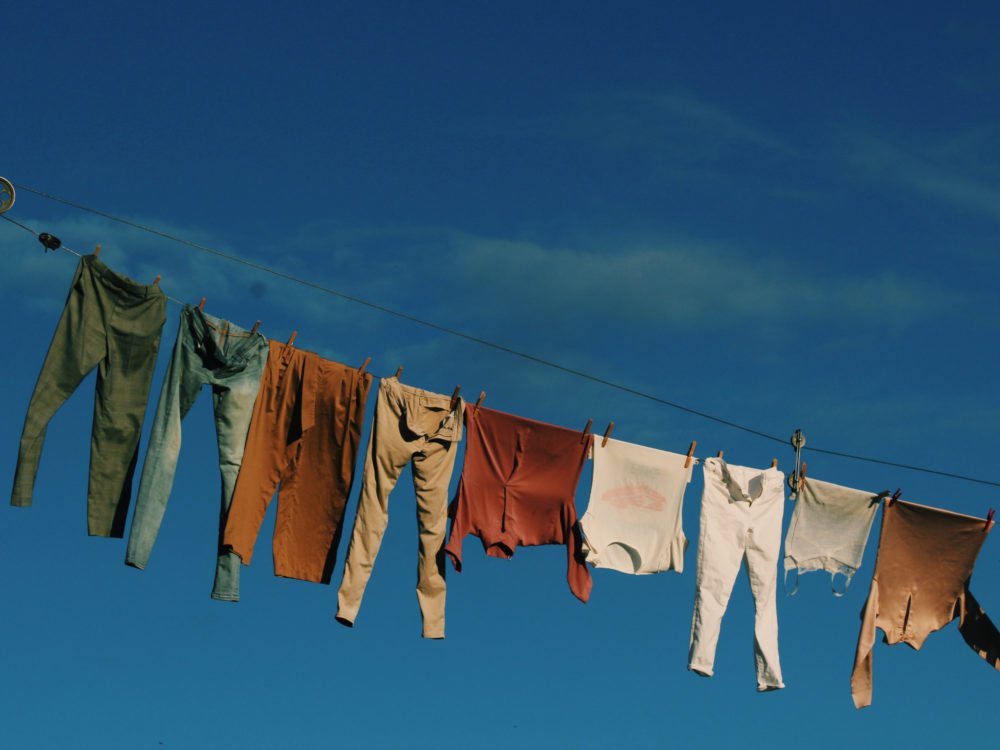 clothes line with clothes drying on it as part of sustainable laundry practices