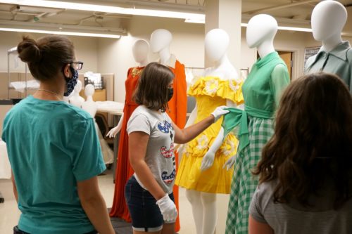Students looking at historic dresses at the Avenir Museum