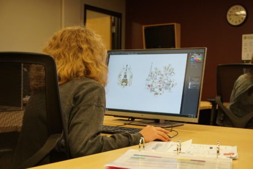 A student works on a design on the computer