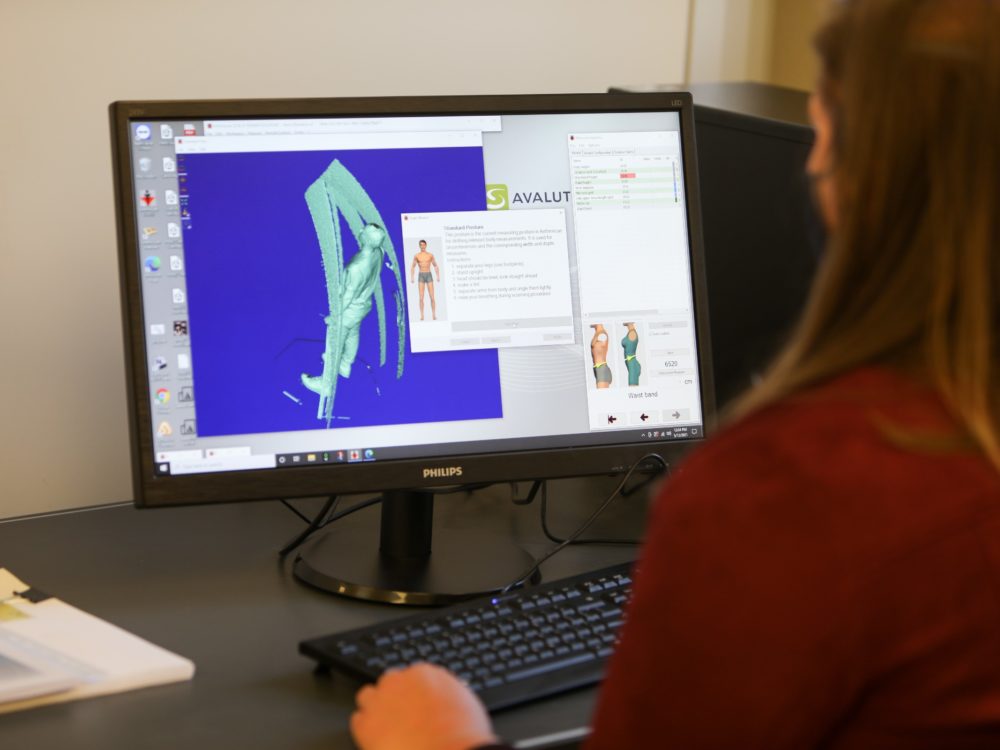 A researcher views a body scan on the computer screen