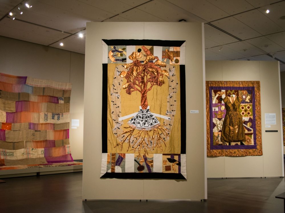 fiber art and modern quilt pieces displayed in the Avenir gallery