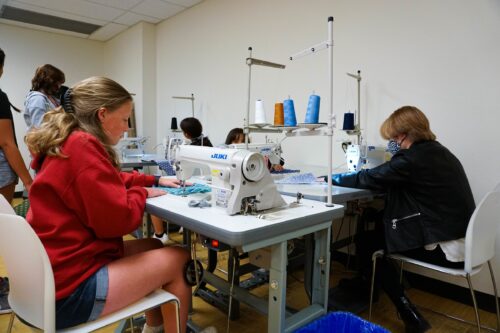 4 Fashion FUN students work at sewing machines
