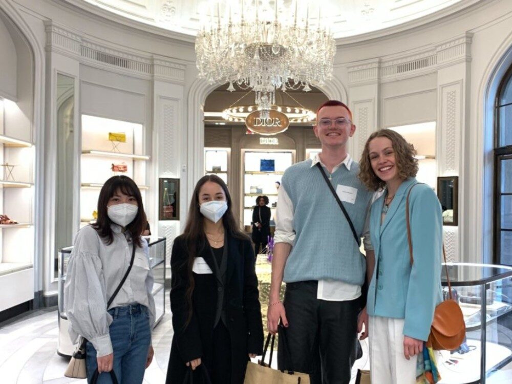 4 students stand in the Dior store on their trip to New York City to accept their scholarship awards