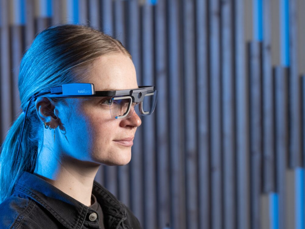 a graduate student wears eyetracking glasses for research
