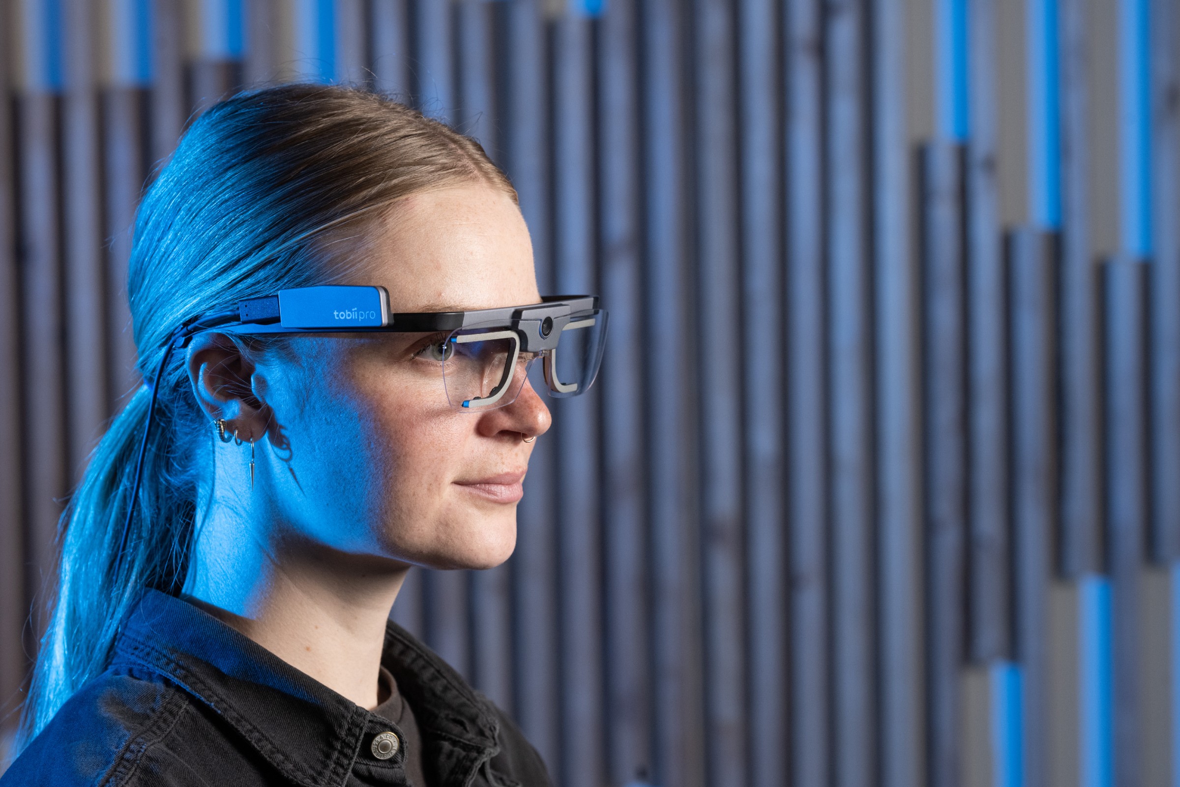 a graduate student wears eyetracking glasses for research