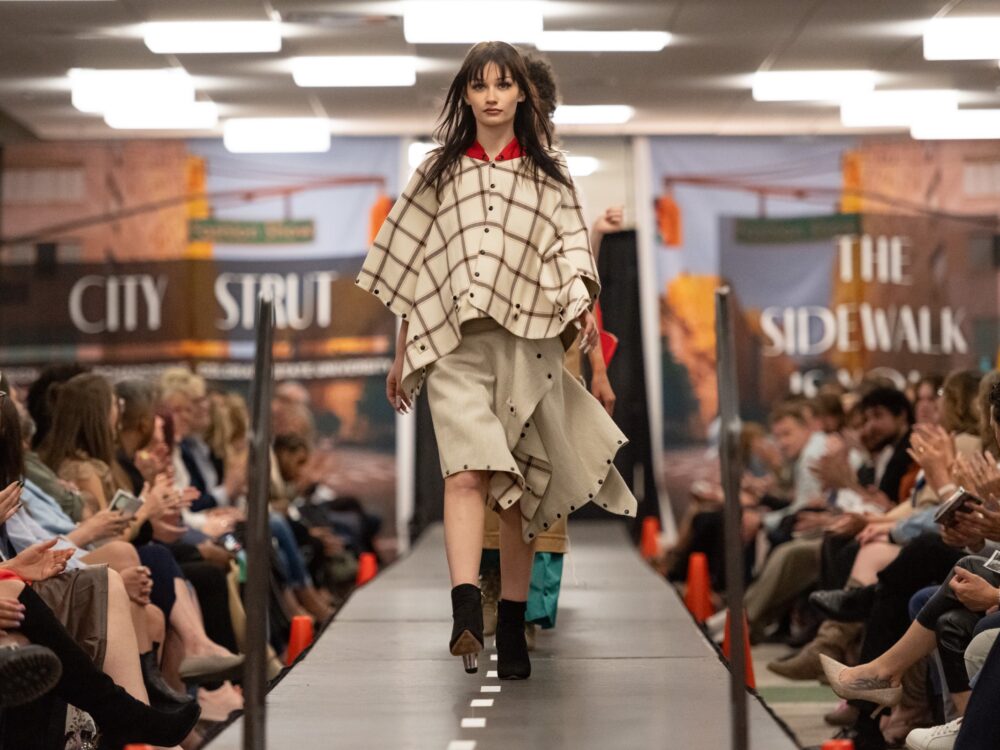 a model walks down the runway at the annual csu fashion show