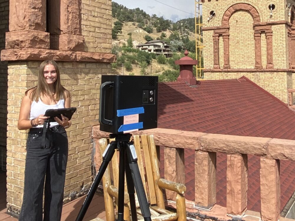 Corrine Sage uses the 3D Matterport camera on a rooftop