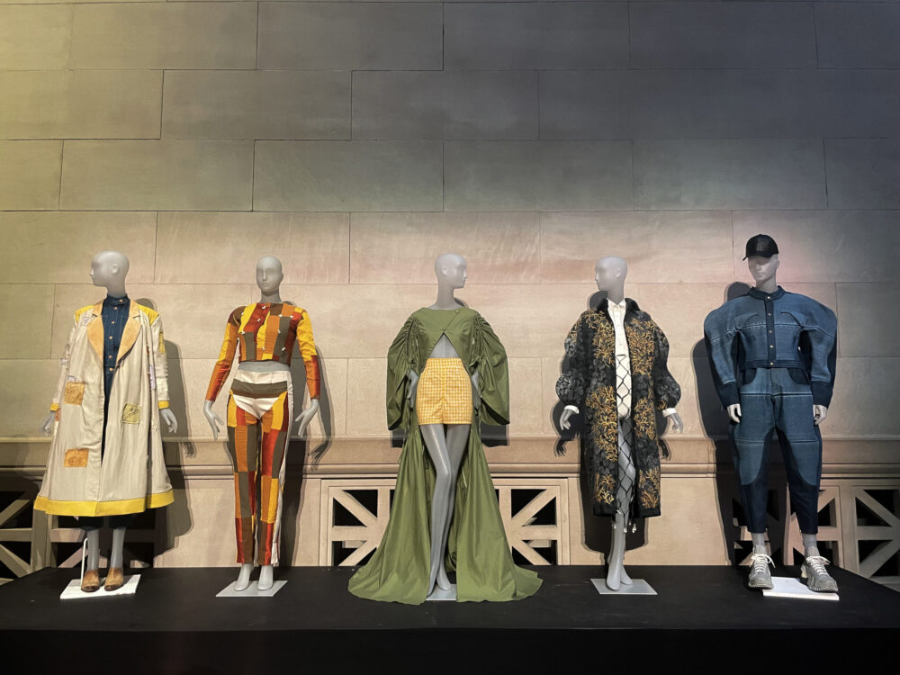 4 mannequins model designs from student finalists in MET college design competition