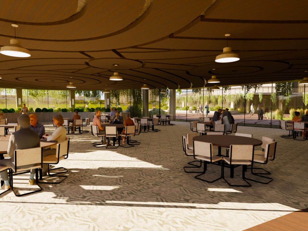 A covered outdoor dining terrace with swirling ceiling patterns, hanging greenery, and round tables arranged across a sunlit patio.