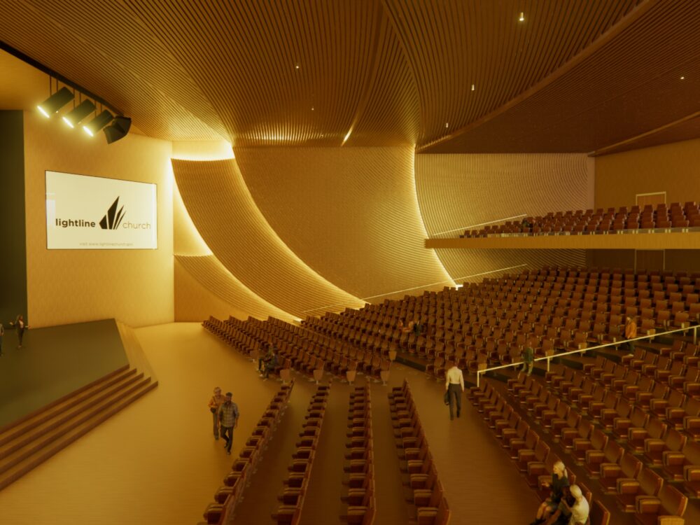 A large auditorium with sweeping wood-textured walls, tiered seating, stage lighting, and a projected screen displaying the Lightline Church logo.