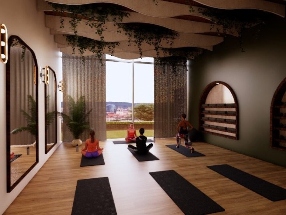 A serene yoga studio with wood floors, arched shelving, hanging greenery, and large windows overlooking an outdoor landscape as people practice on mats.