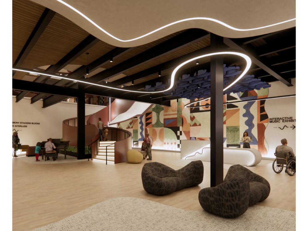 Interior design rendering of a creative community space featuring a sculptural ceiling light, colorful geometric mural, and curved staircase leading to an upper level. Lounge seating, an information desk, and accessible pathways populate the room. Signage on the walls directs visitors toward an interactive music exhibit. The space has warm wood flooring and dramatic overhead lighting integrated into ceiling beams.