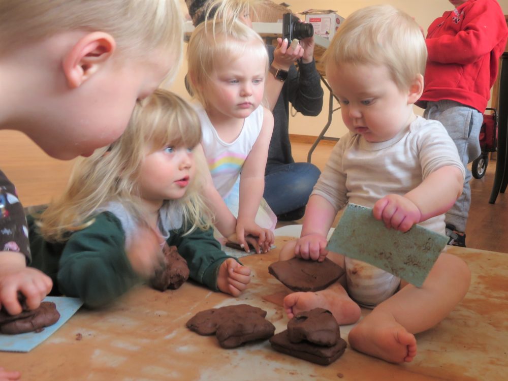 Children play with clay.