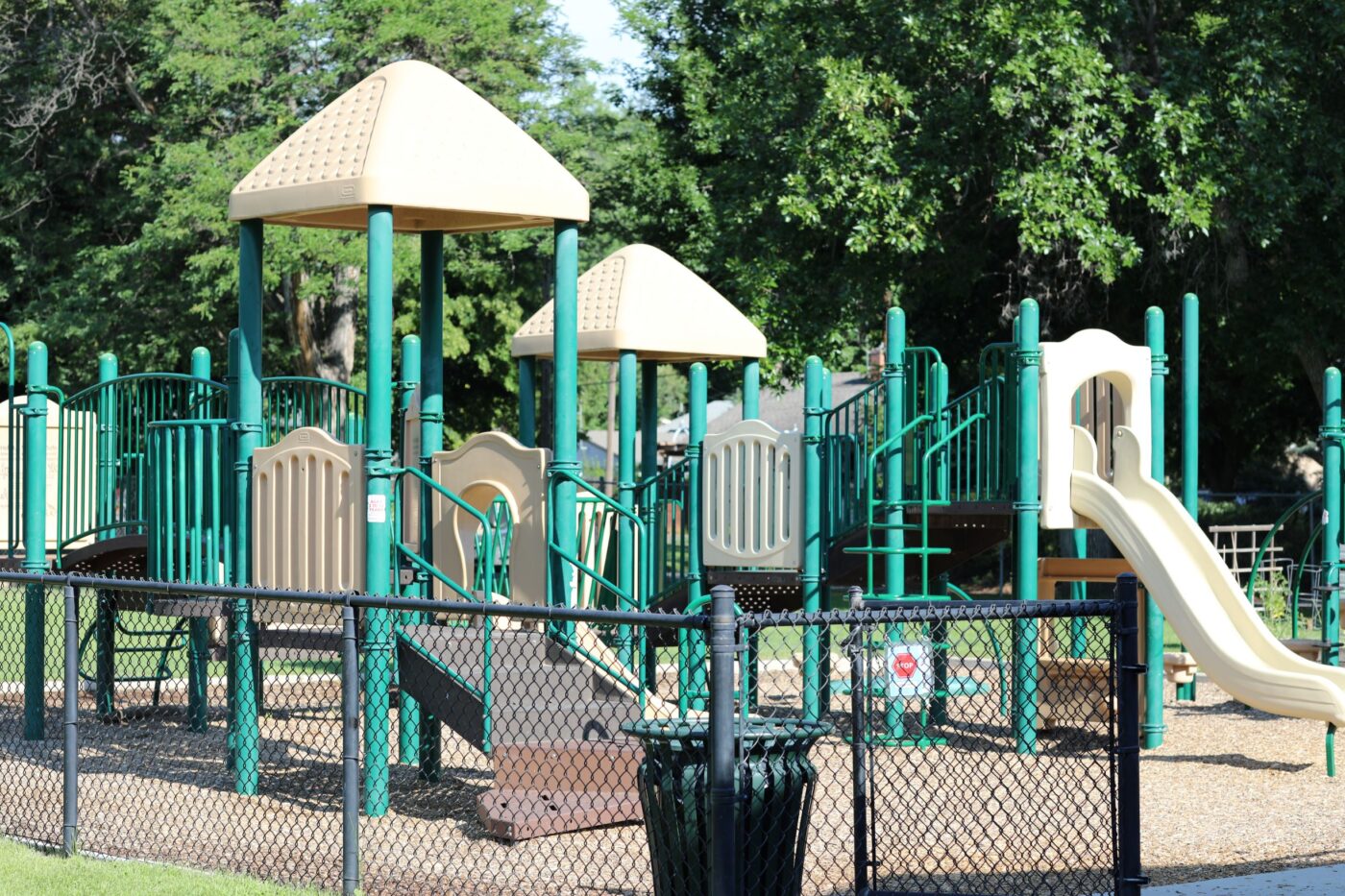 Play area with slides, stairs, and climbing areas
