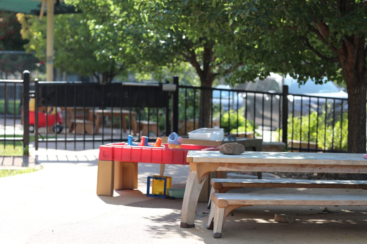 Play area outside with a picnic table