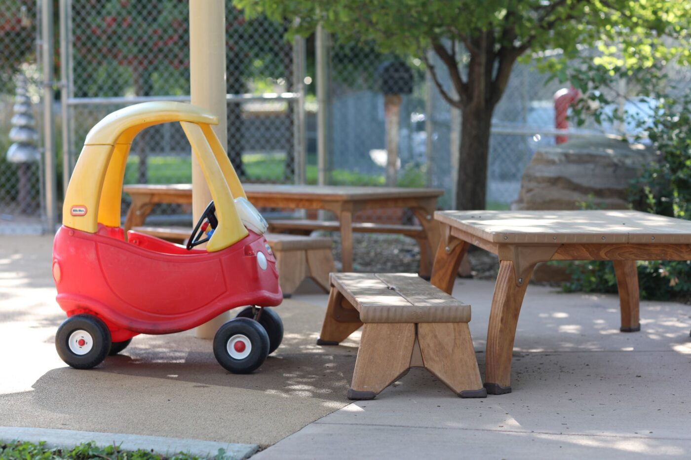 Yellow and red tow car and a picnic table