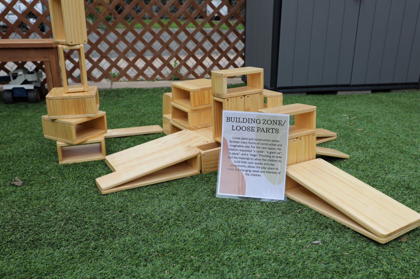 Giant building blocks with sign that says "Building Zone/Loose Parts"