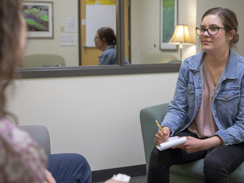A therapist listens during therapy.