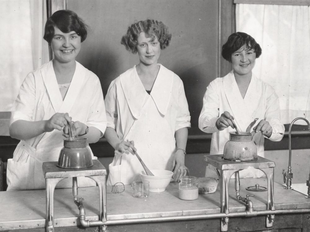 Three women cooking 1920's