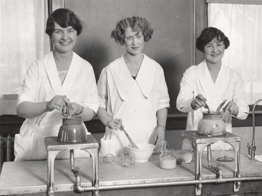 Three women cooking 1920's