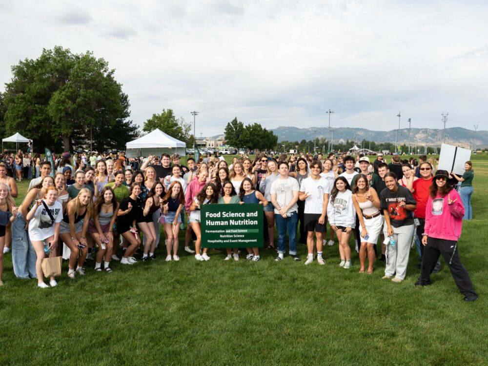 A large group of CSU Food Science and Human Nutrition students smile on CSU's intramural fields.