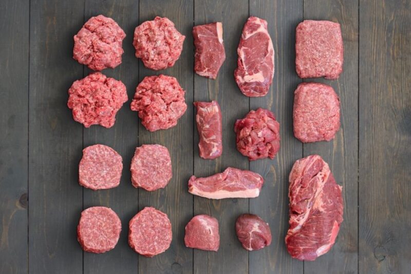 A collection of beef meats on a wooden block
