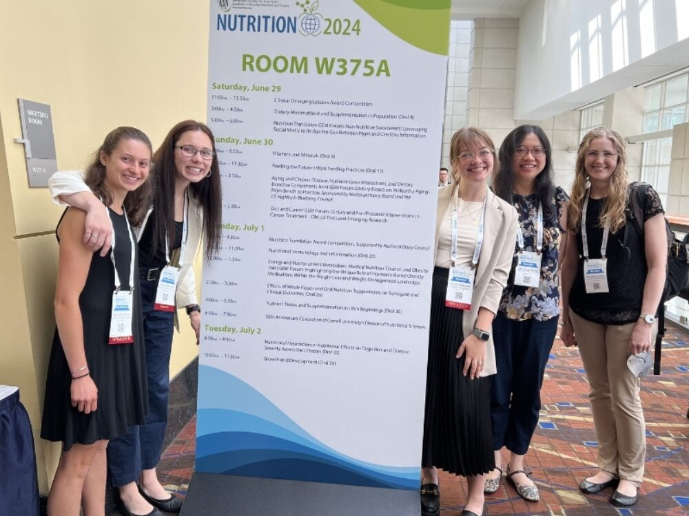 Lab members (left to right) Gabrielle Glime, Mikayla Hernandez, Dr. Minghua Tang, and Jennifer Kemp at the American Society of Nutrition annual meeting 2024.