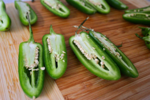 Halved jalapeños with seeds and veins.