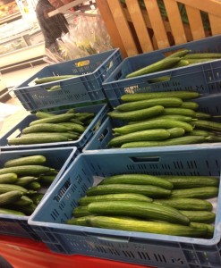 English cucumbers for sale in at an outdoor market 