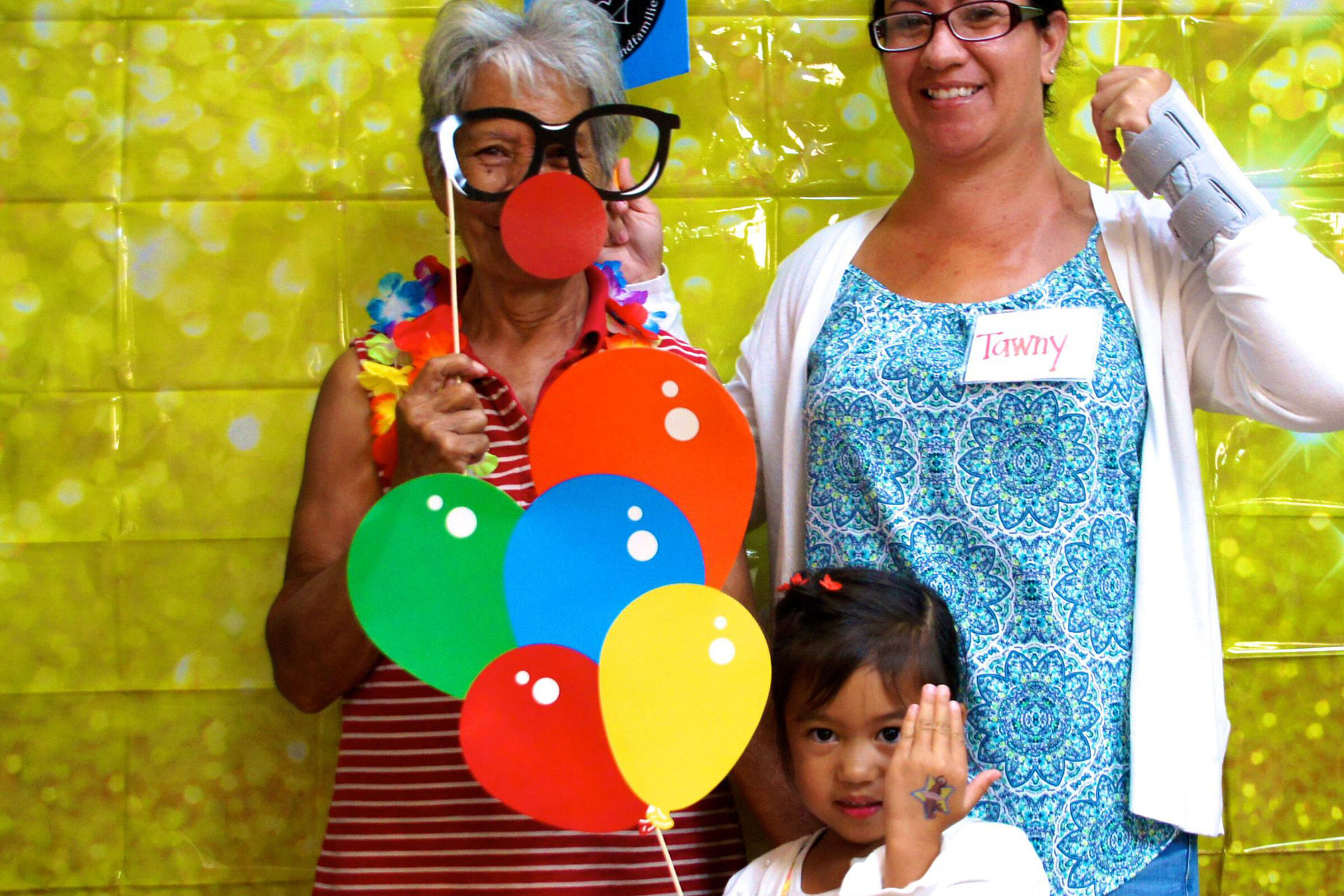 Three generations of family members at Hawaii game night