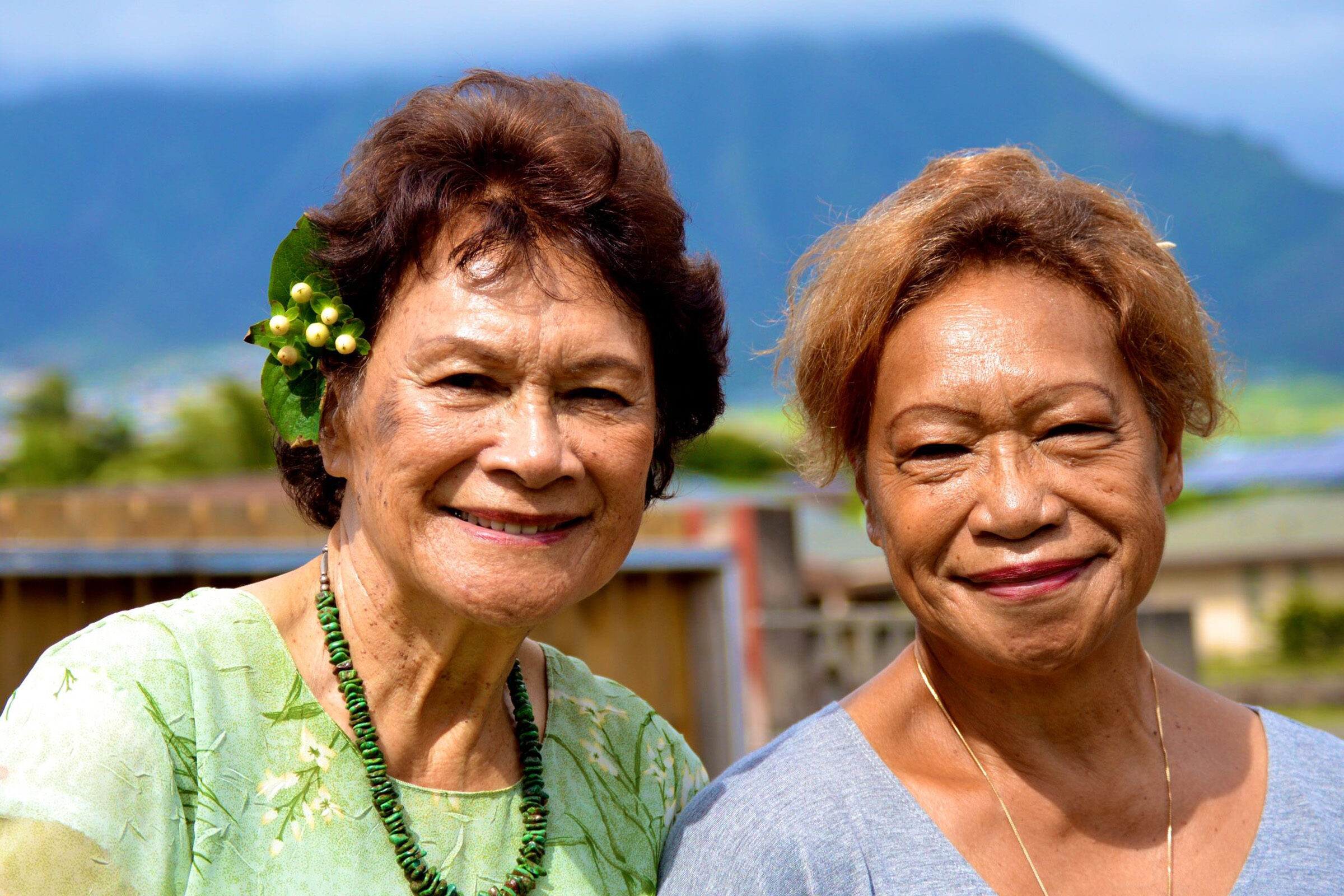 Two grandparents pose for a photograph