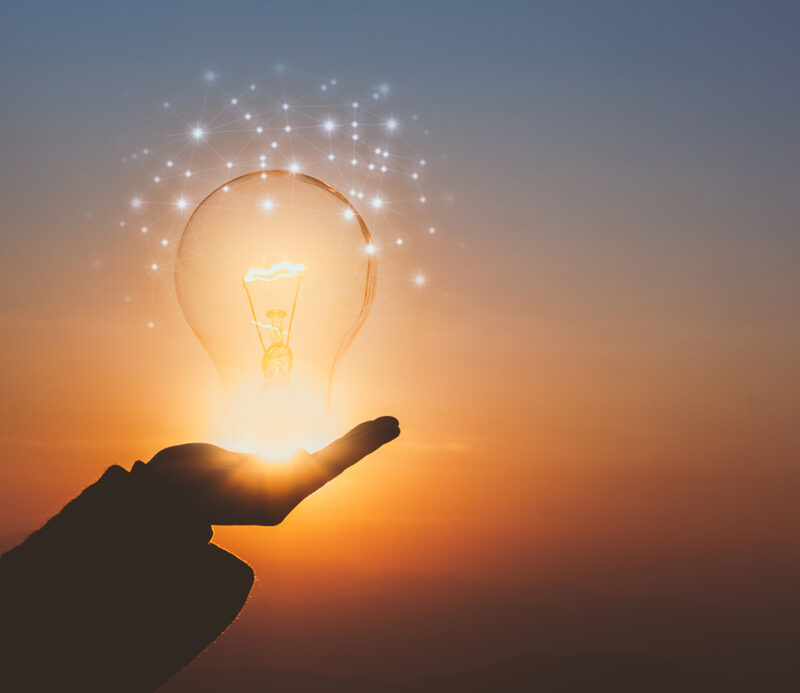 lightbulb in someone's hand signifying ideas