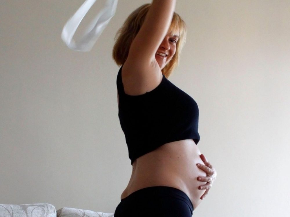 A woman dances while pregnant