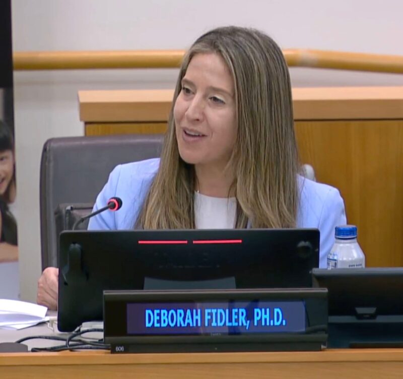 Deborah Fidler smiles while giving a presentation at World Down Syndrome Day 2025.