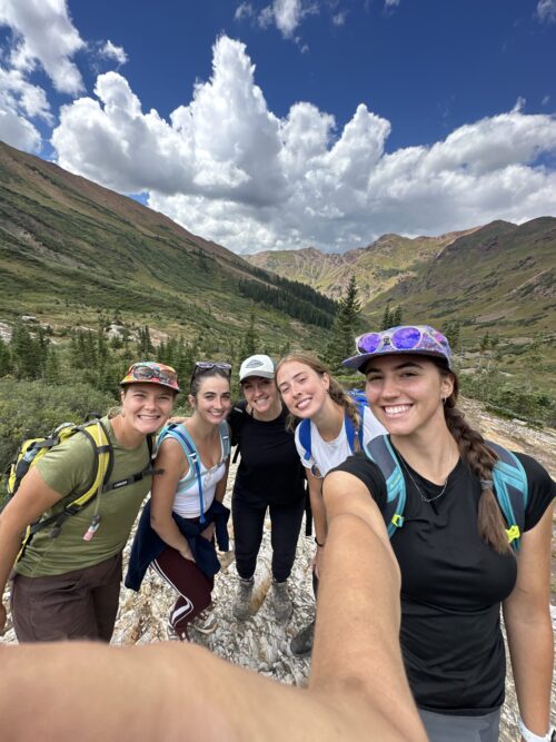 Five members of the PATP Lab team smile while outdoors on a hike.