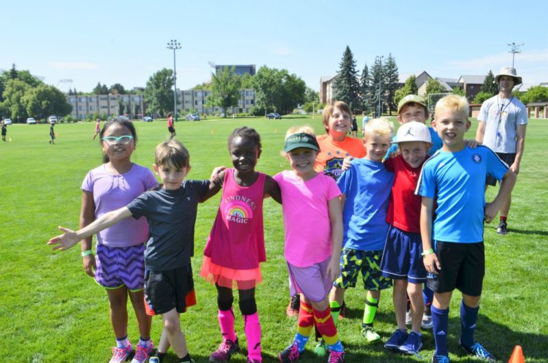a group of kids smiling at youth sport camps
