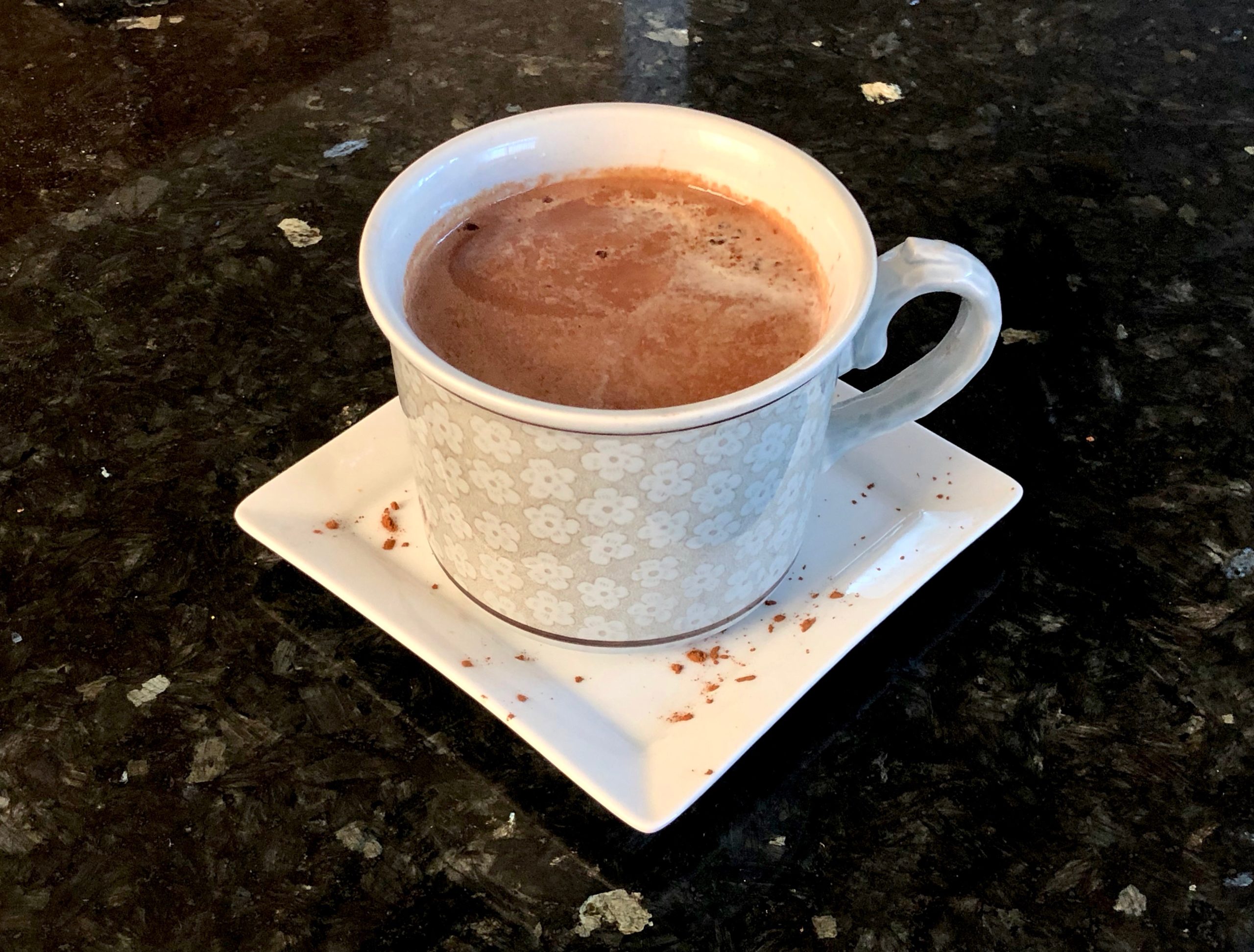 Mug of hot chocolate on saucer