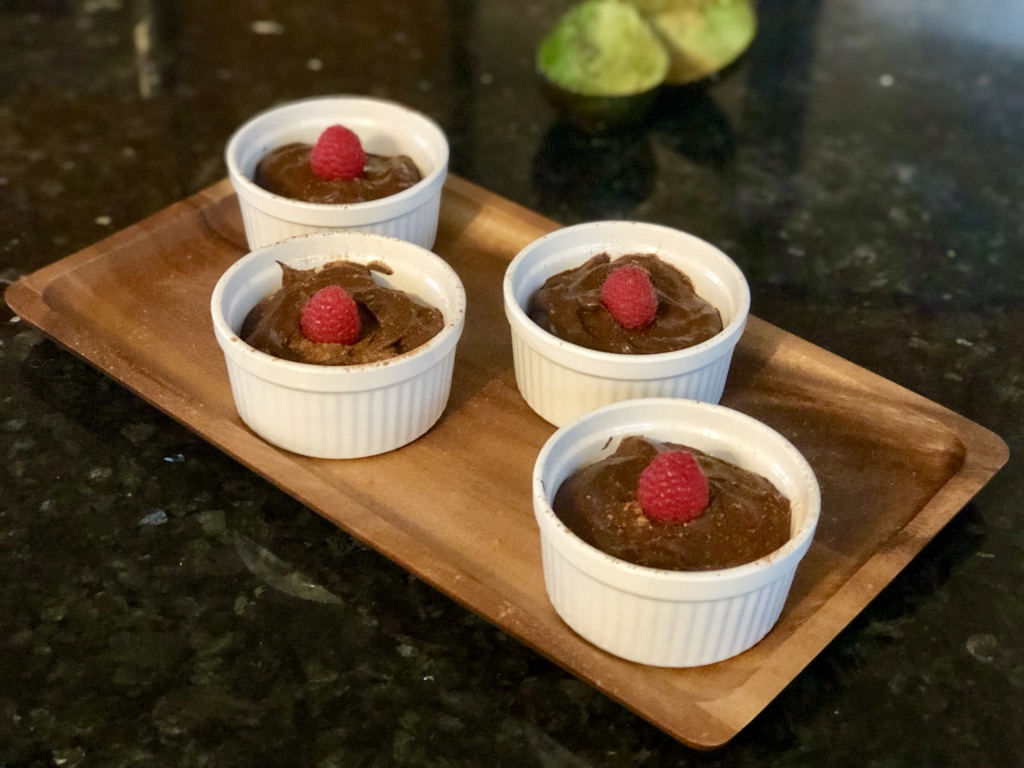 Chocolate avocado mousse with raspberries on top