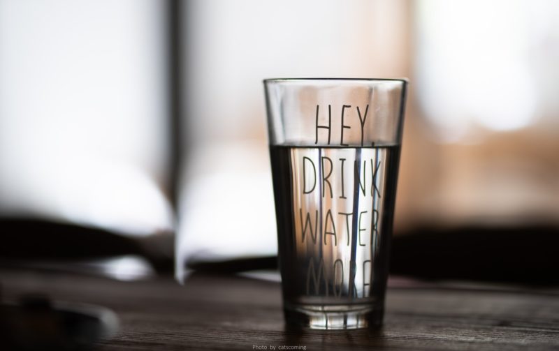 Water glass with message to drink more water