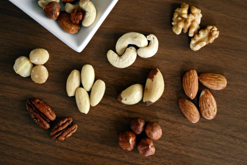 various nuts on brown tabletop
