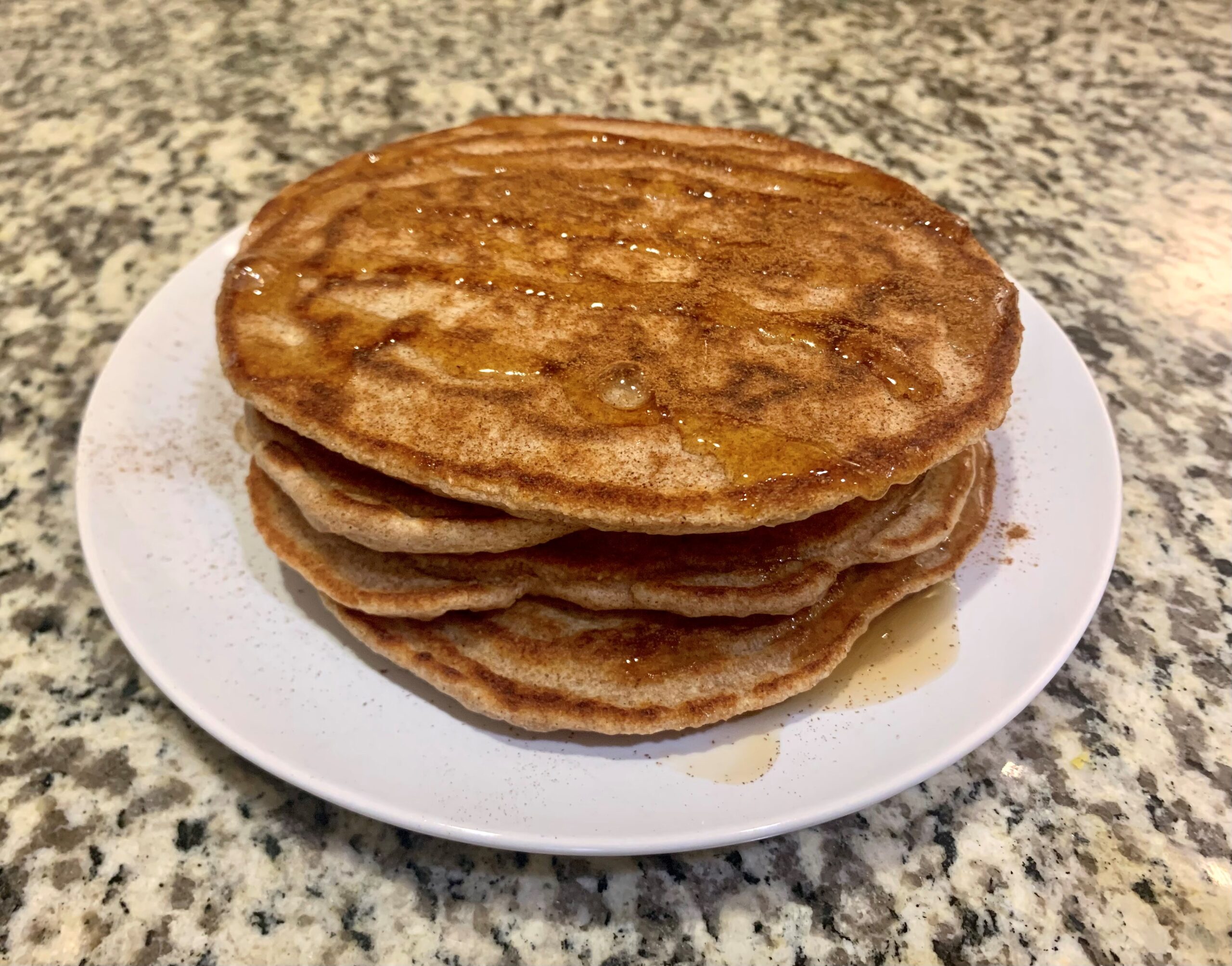 Protein pancakes with honey on a plate