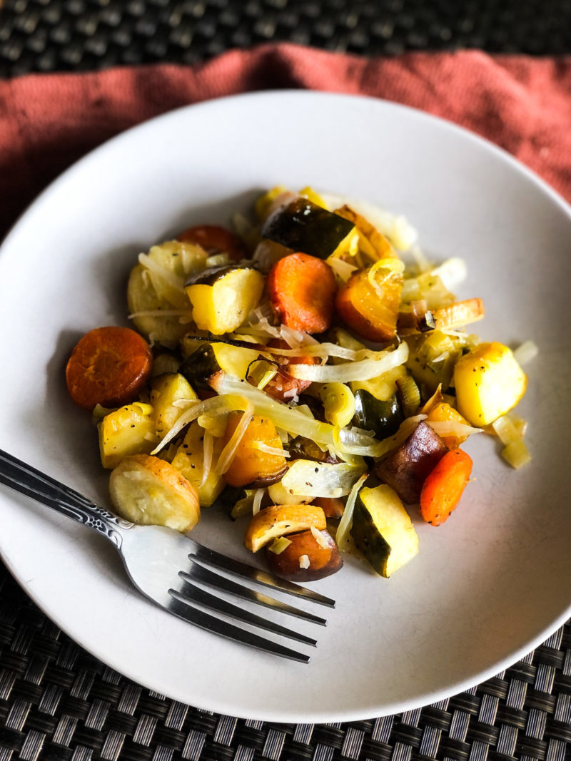 Roasted mixed veggies on a plate with fork