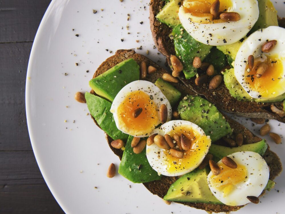 toast with soft boiled eggs, avocado and seeds